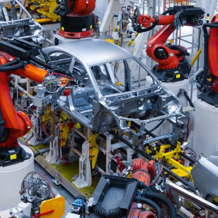 Assembly line production of new car. Automated welding of car body on production line. robotic arm on car production line is working